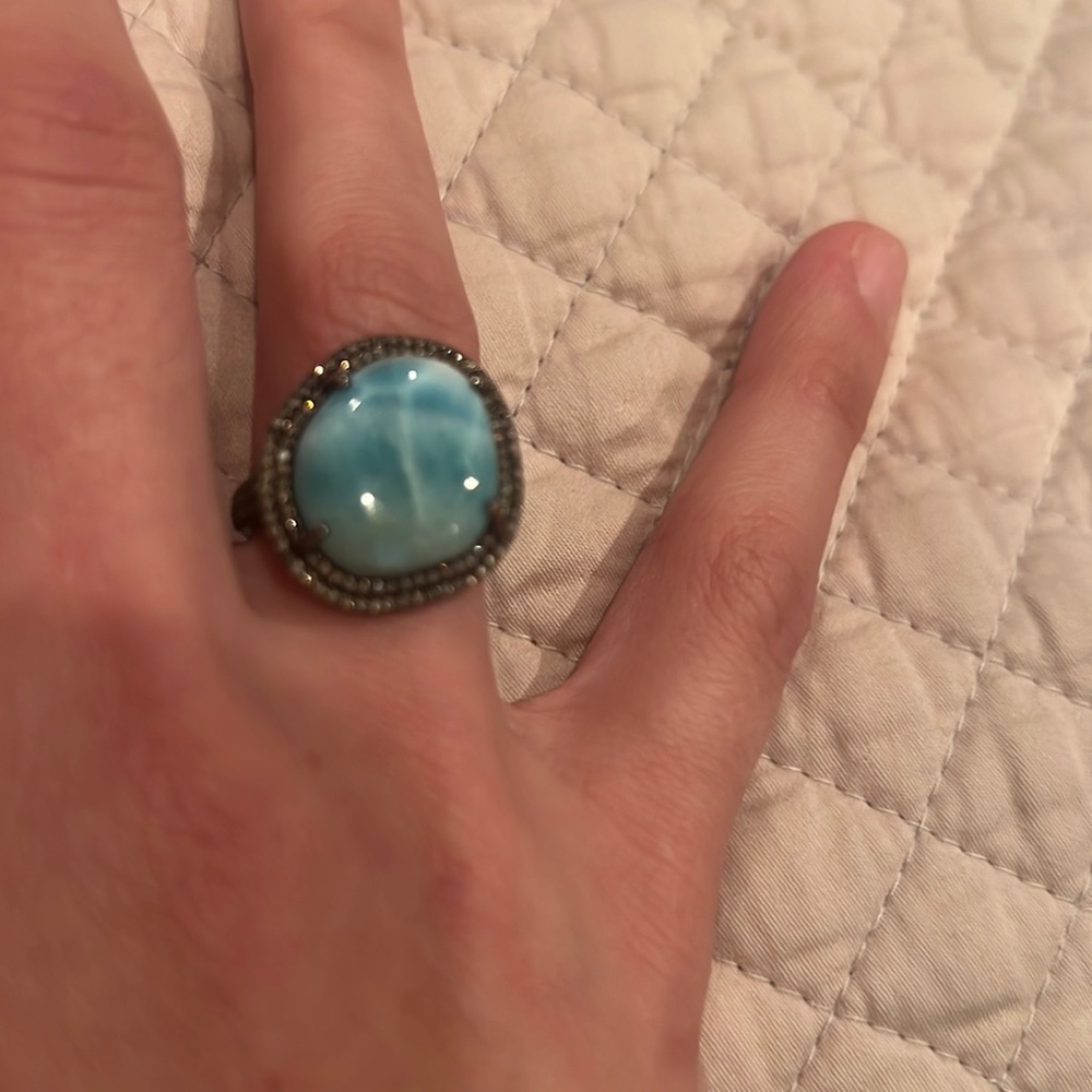 Diamond ring over silver